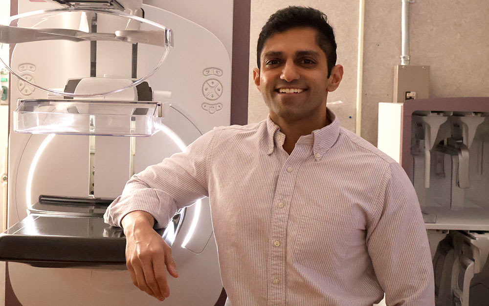 Radiologist Dr. Dil Patel in front of a mammography machine