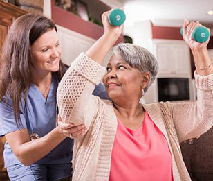 A doctor helping a lady in home workout.
