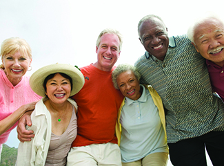 A group of senior citizens smiling and posing for a picture.