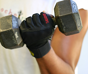 A man holding a dumbbell.