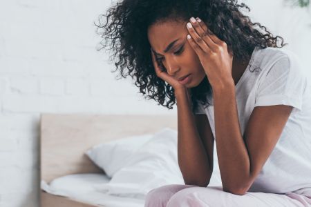 Woman suffering from a migraine