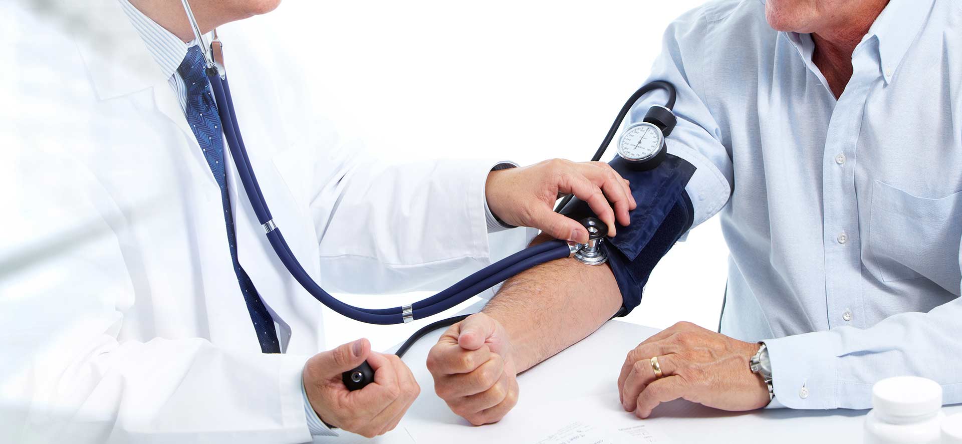 Doctor checking a man's heart beat and blood pressure